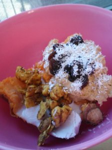 Another dinner: Thai stuffed sweet potato. Half a large sweet potato topped with peanut flour paste and raisins/coconut shreds on one side, coconut cream and raw Thai curry cashews on the other. 
