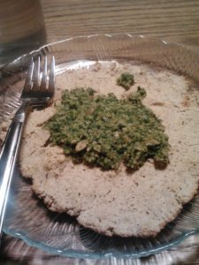 Homemade grain free pizza with homemade kale pesto made from the remnants of my last grocery haul. 